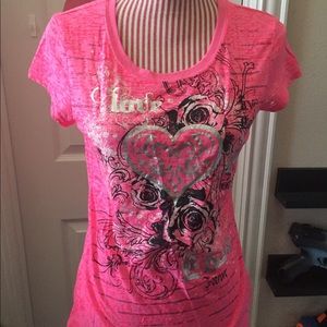 Pink graphic tee shirt.